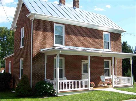 red brick house with blue metal roof|red brick house roof colours.